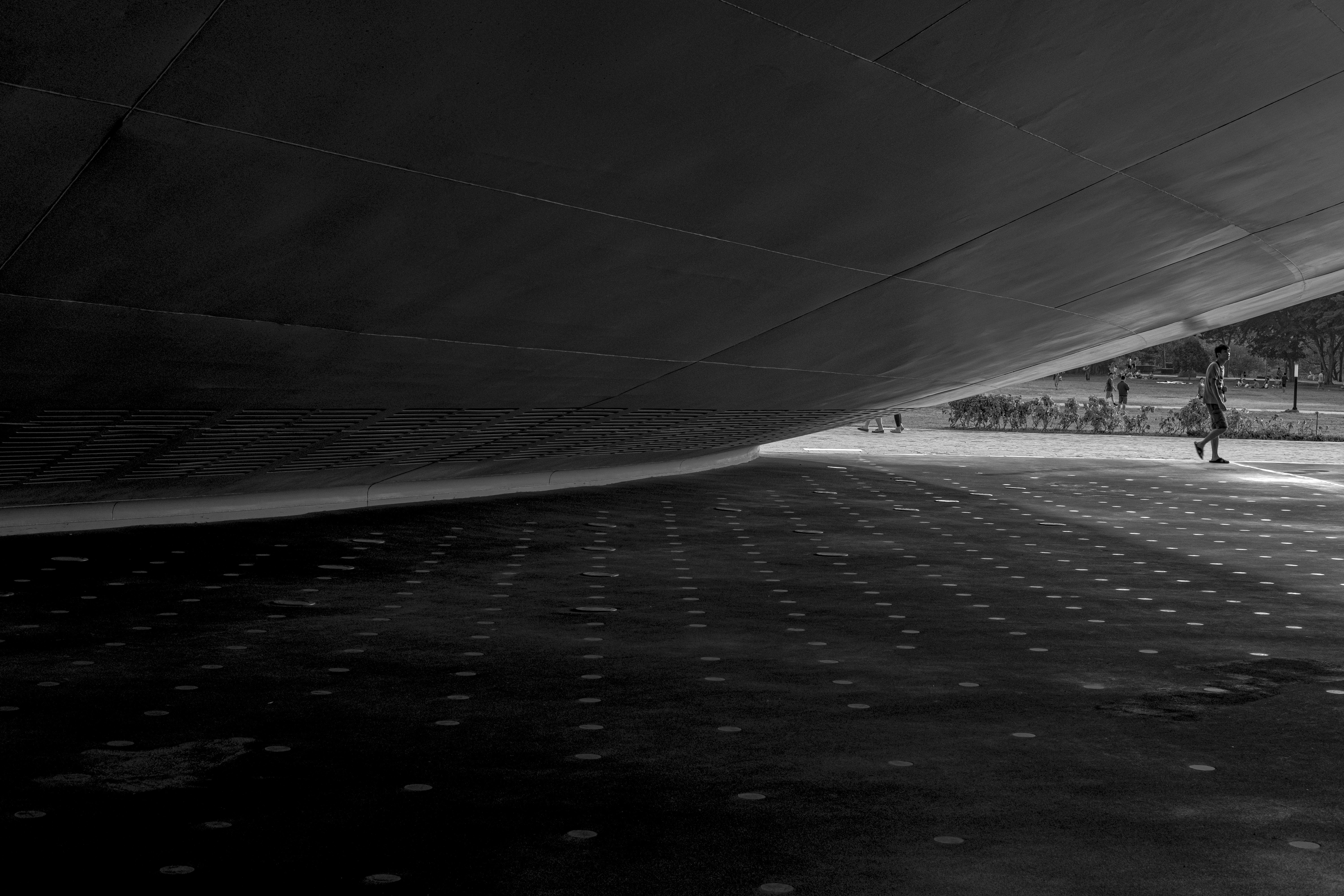 grayscale photo of road covered with snow