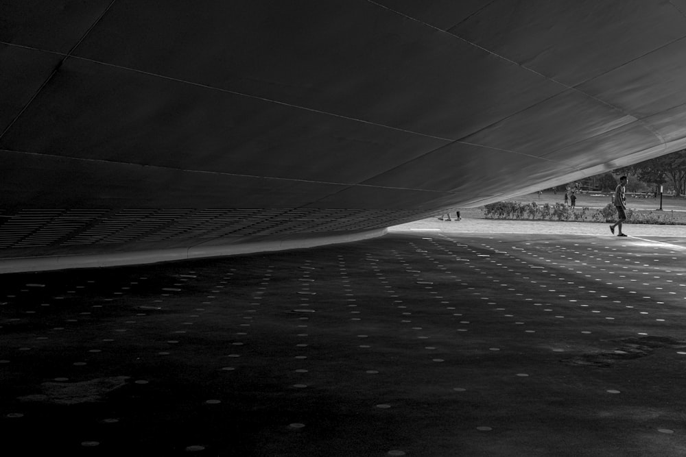 grayscale photo of road covered with snow