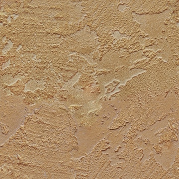 A textured surface with rough, irregular patterns resembling stucco or plaster. The surface appears to have varied depth and a weathered appearance, with different sections catching light differently.