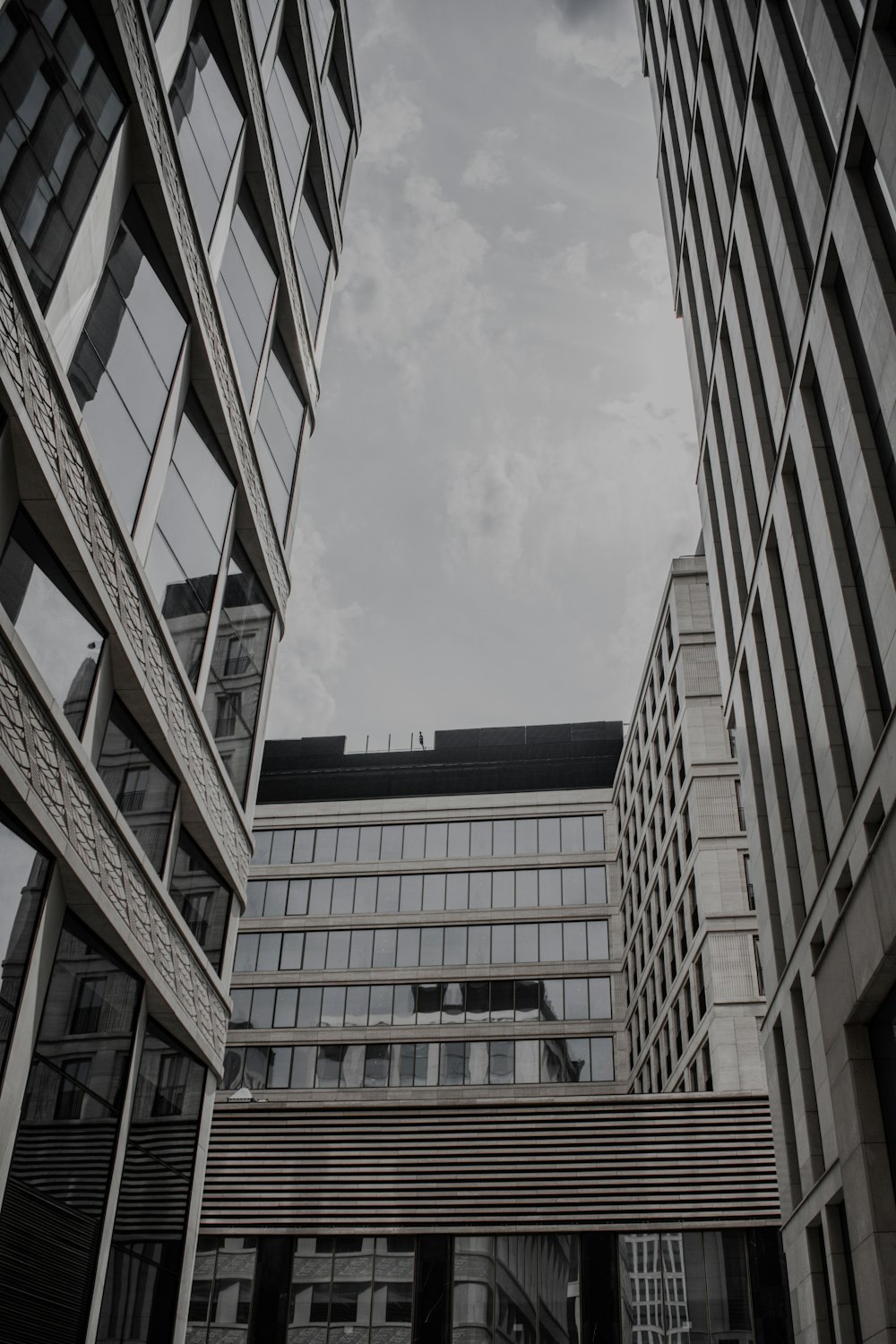 brown concrete building under white clouds during daytime