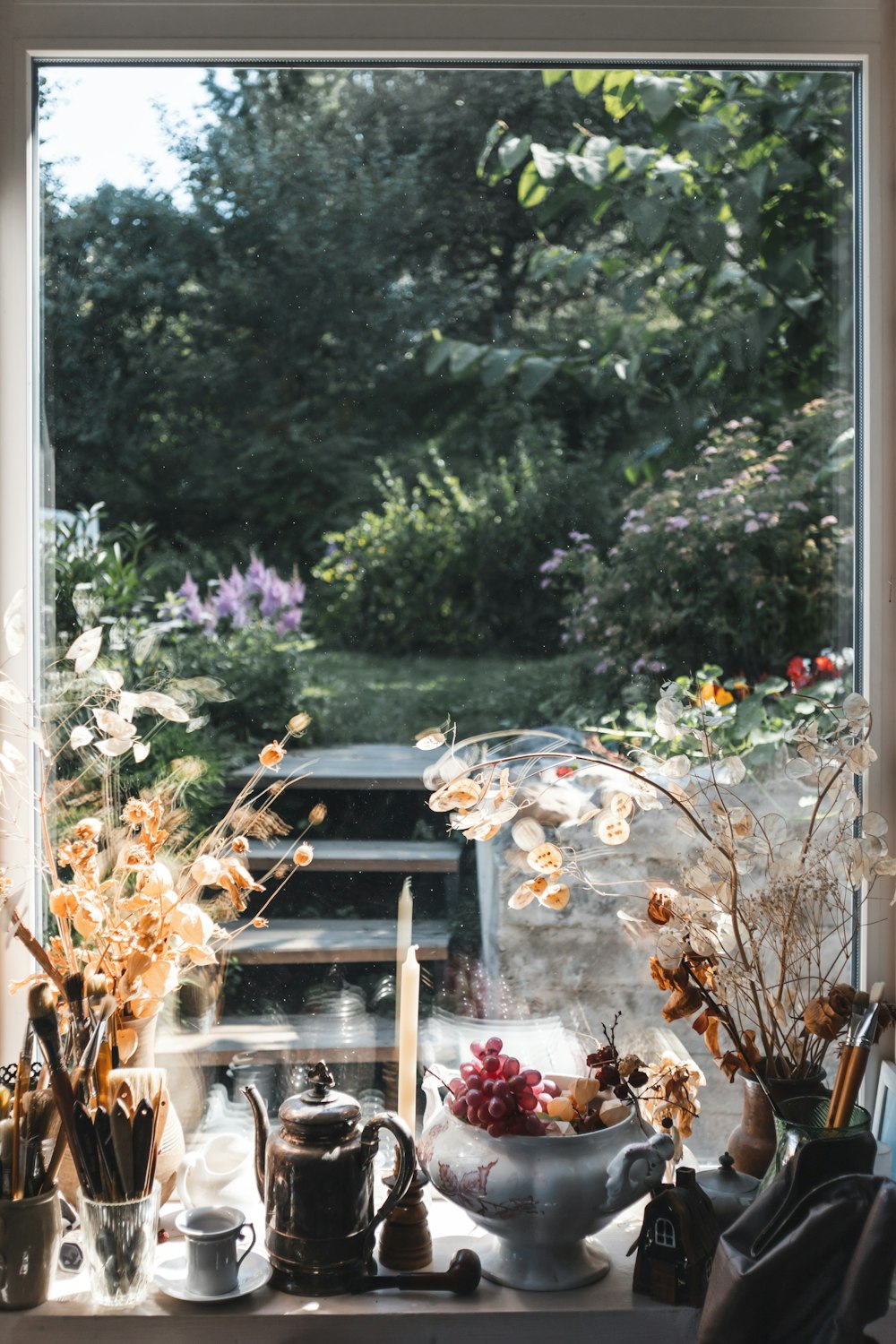 white and pink flowers on white window