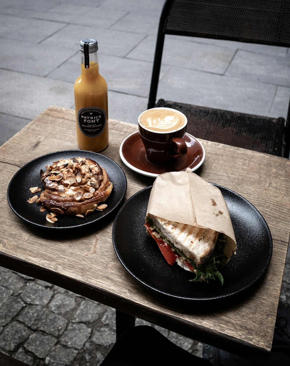 cooked food on black plate beside coca cola bottle