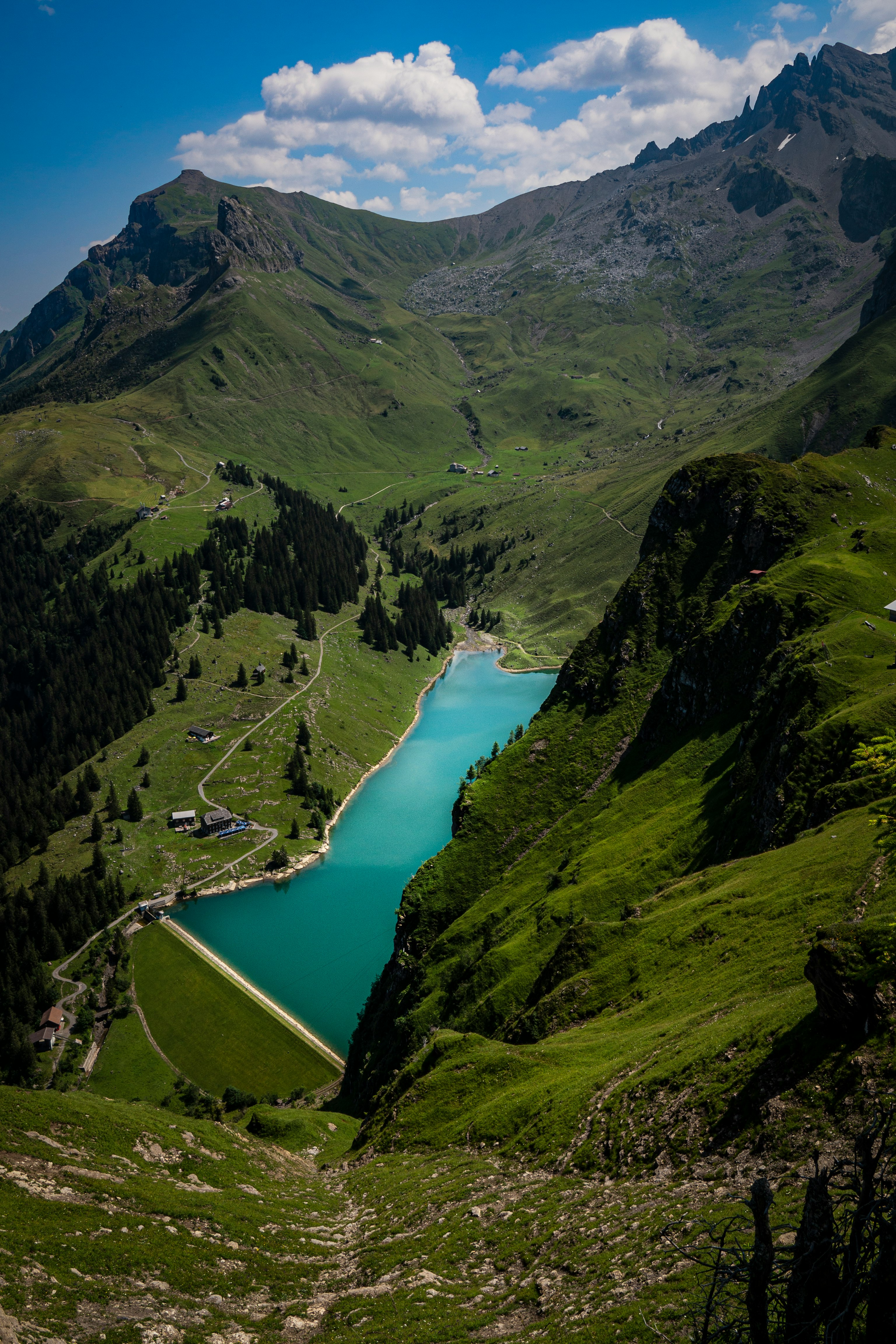 green mountains beside river during daytime