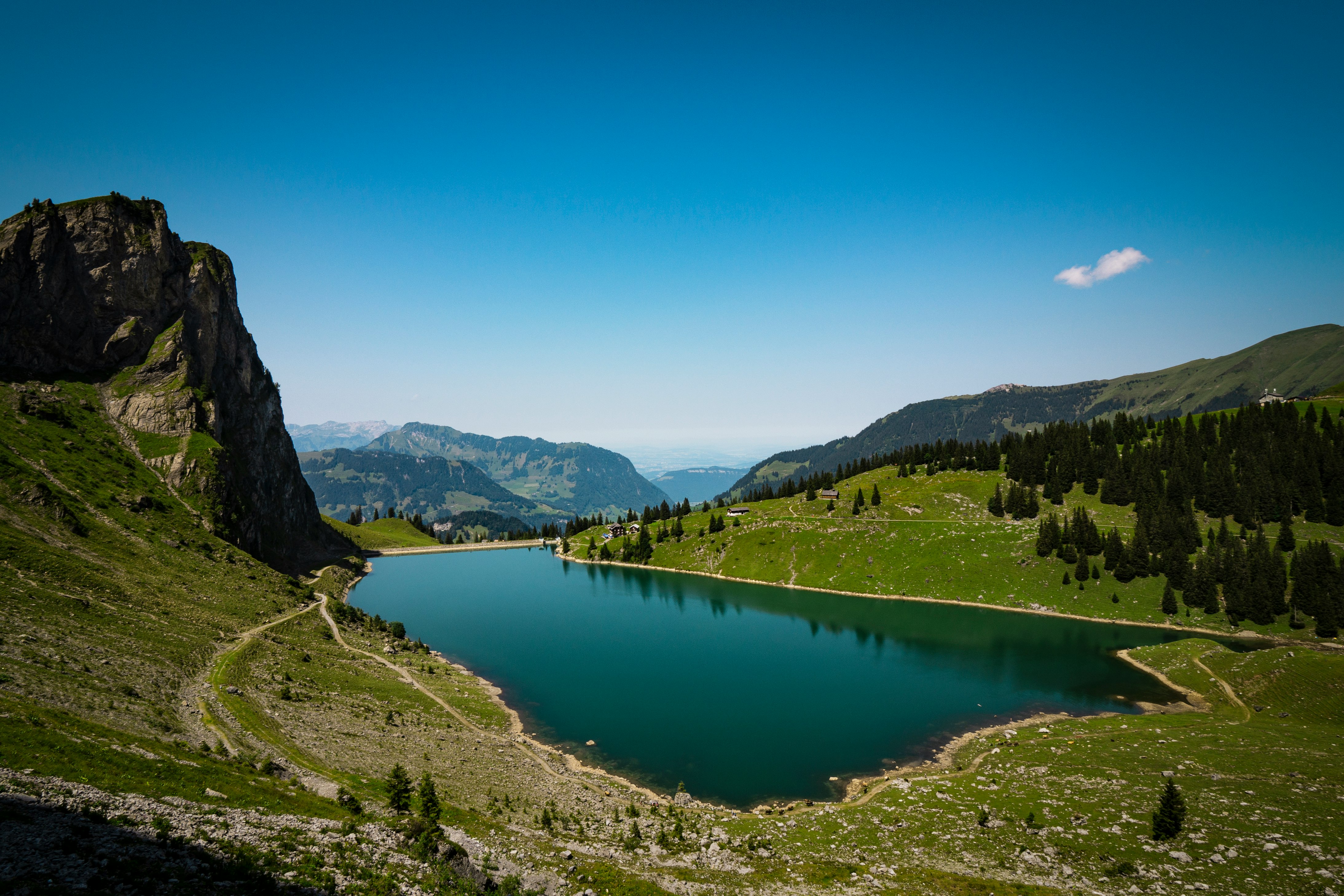 lake in the middle of mountains