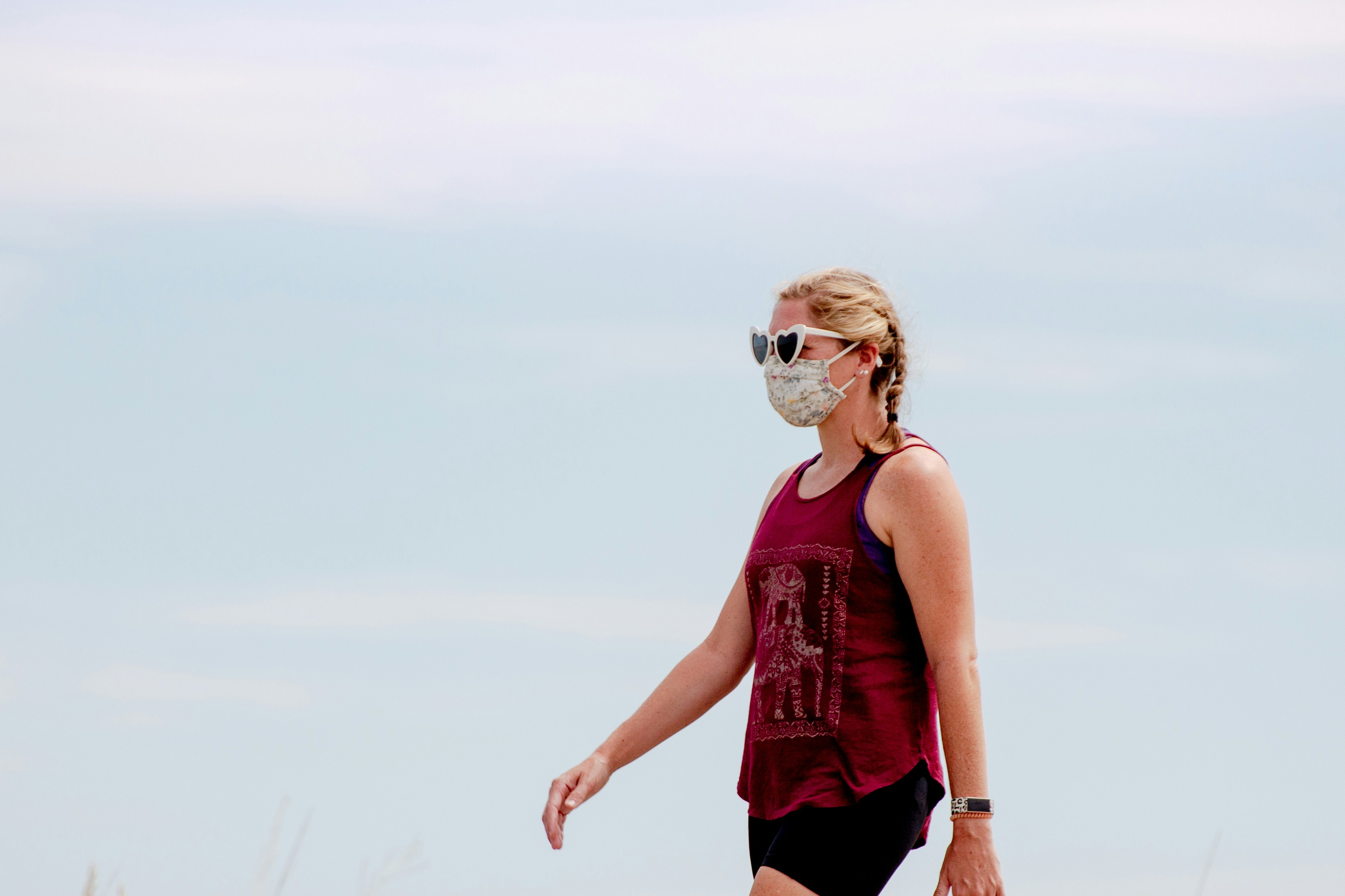 woman in red tank top wearing white goggles