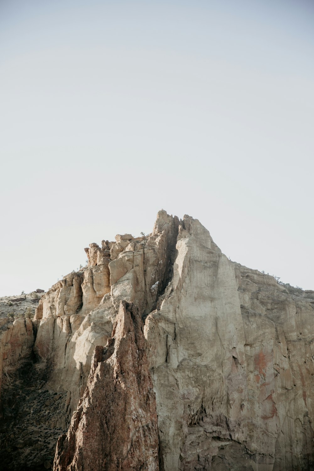 brown rocky mountain under white sky during daytime