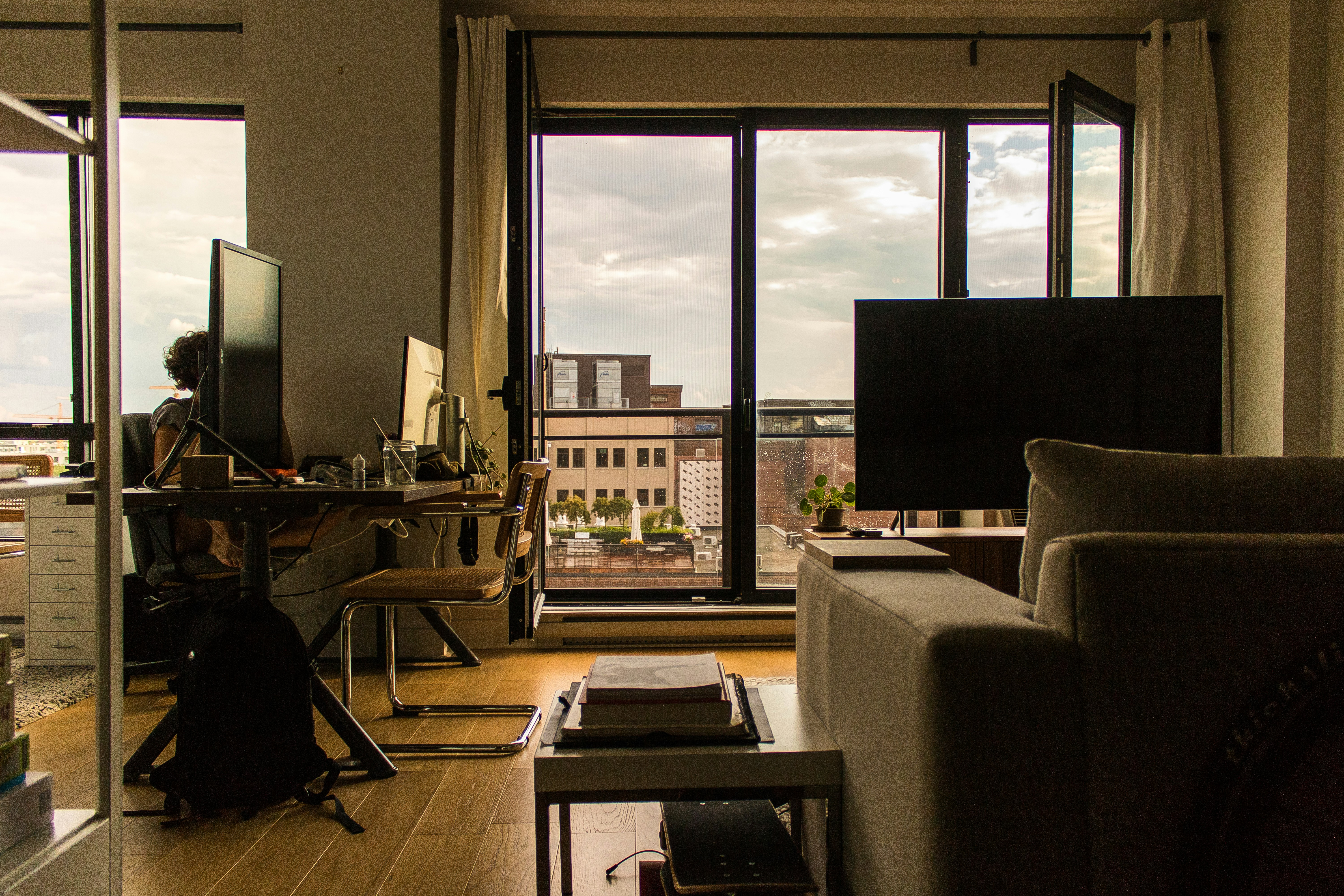 black flat screen computer monitor on brown wooden desk