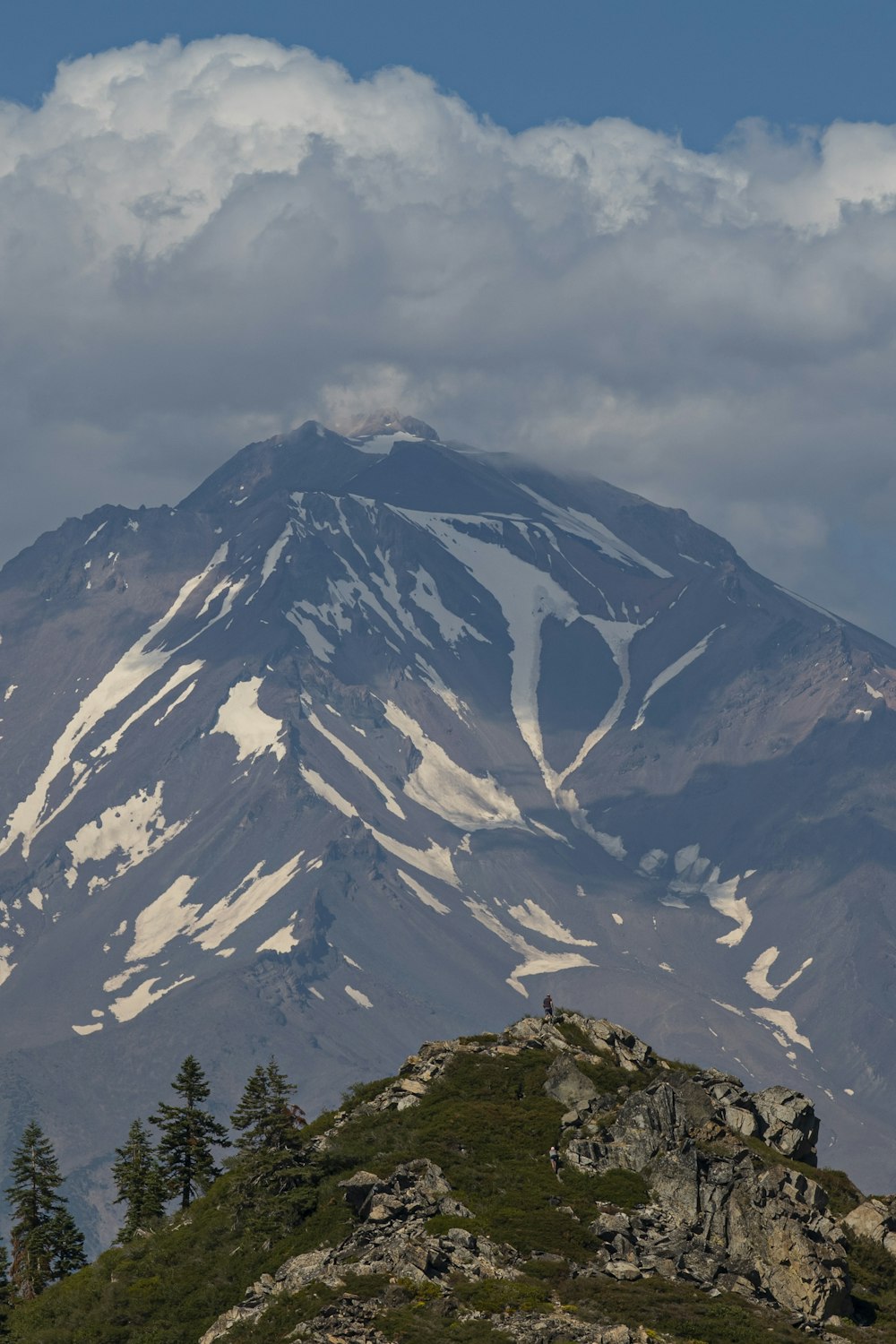 snow covered mountain under cloudy sky during daytime