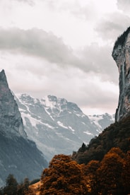 rocky mountain under white cloudy sky during daytime