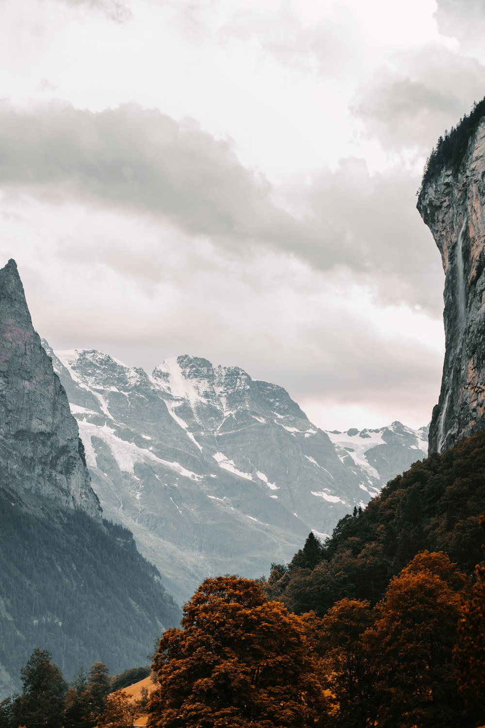 rocky mountain under white cloudy sky during daytime