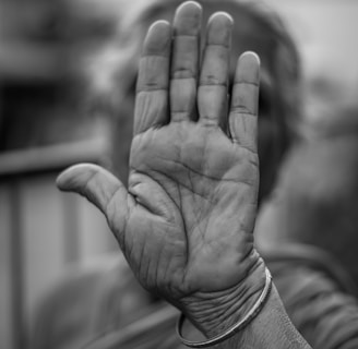 grayscale photo of persons left palm