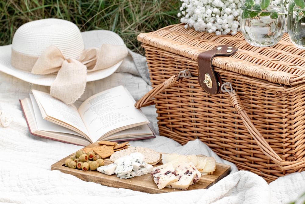 white and brown wicker basket with white textile