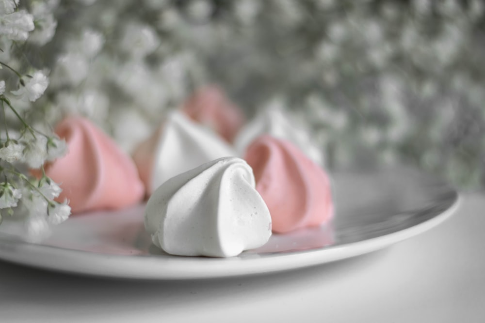 white and pink ceramic plate