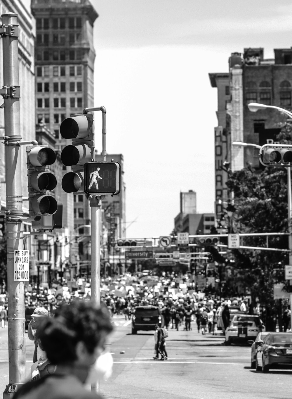 grayscale photo of people walking on street