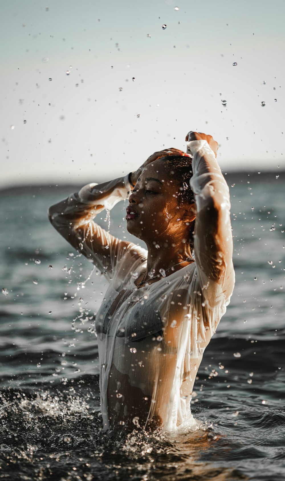 woman in white dress in water