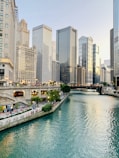 white and brown concrete buildings near body of water during daytime