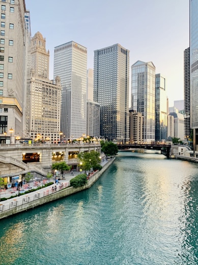 white and brown concrete buildings near body of water during daytime