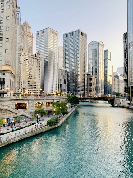 white and brown concrete buildings near body of water during daytime
