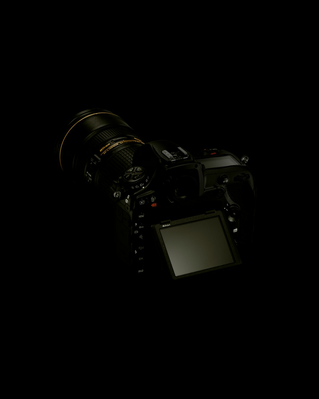 black dslr camera on white surface