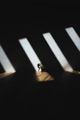 A dark studio with a spotlight illuminating a lone chair, evoking mysterious cinematic tension.