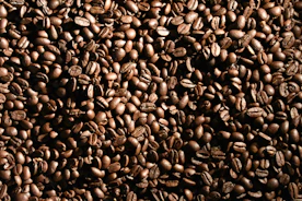 black coffee beans forming heart