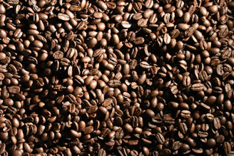 black coffee beans forming heart