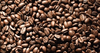 a pile of coffee beans is shown in this image