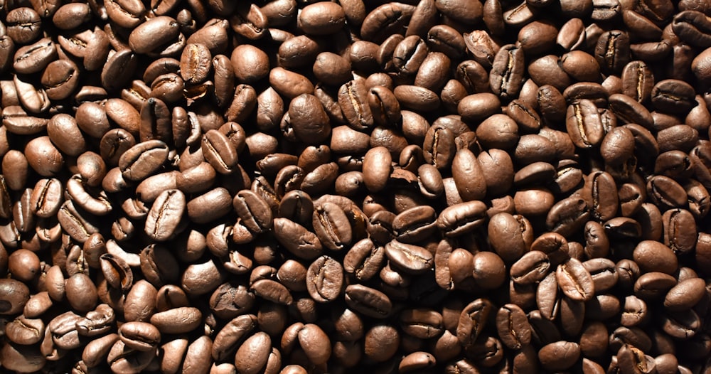 a pile of coffee beans is shown in this image
