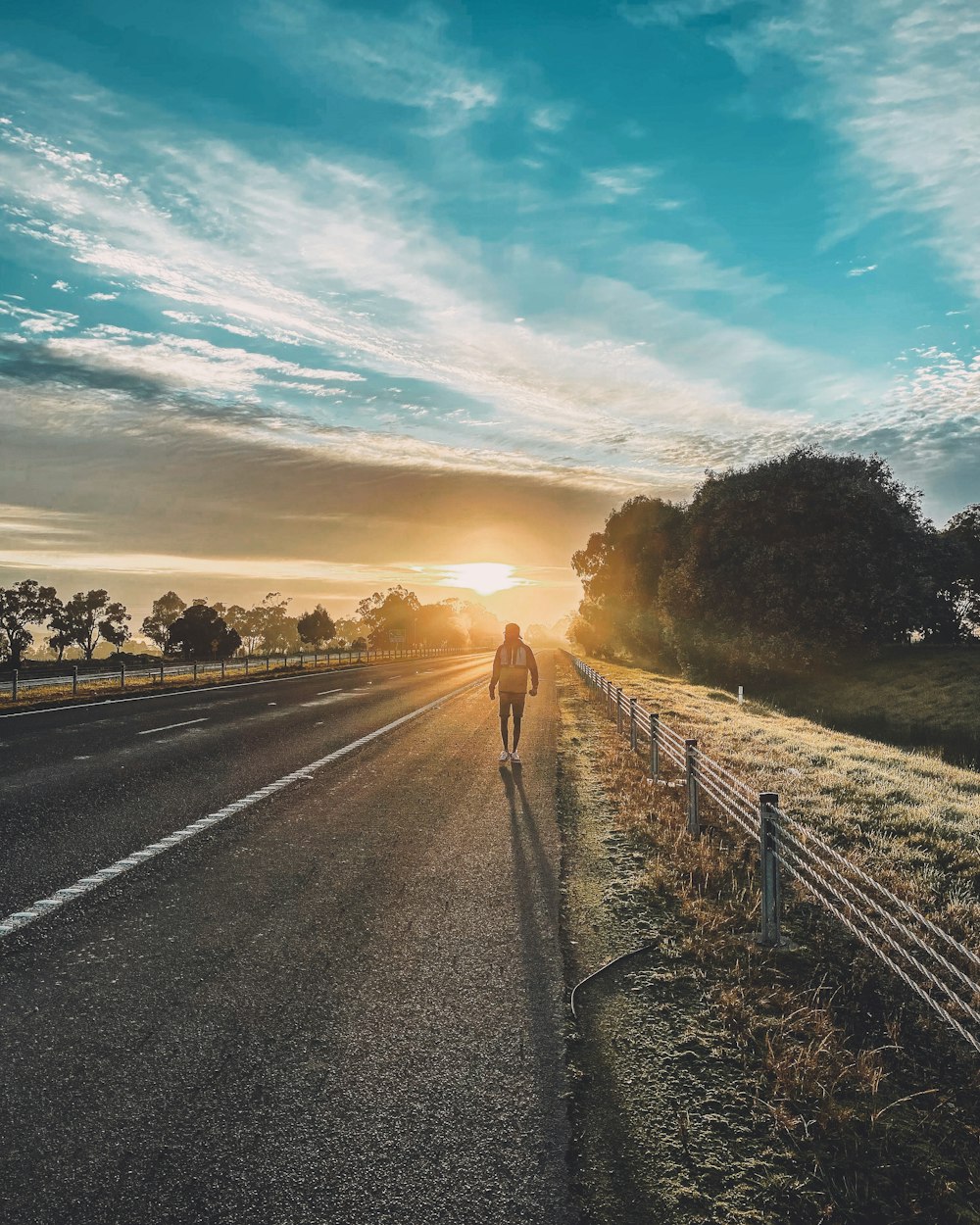 gray asphalt road during sunset