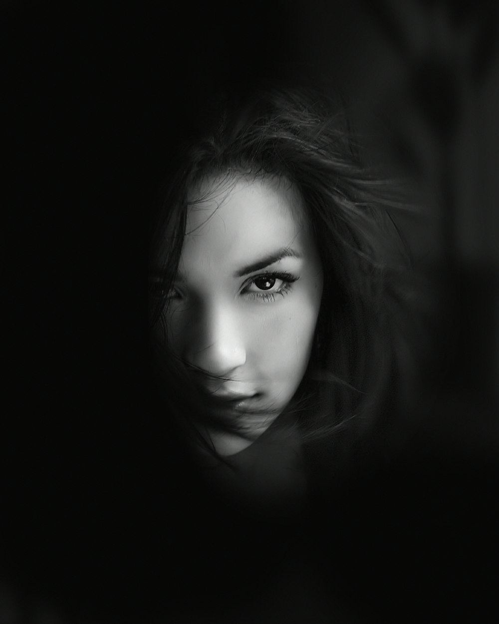 grayscale photo of womans face