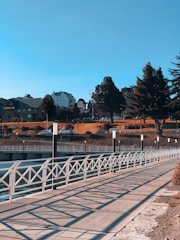 white metal bridge over river during daytime