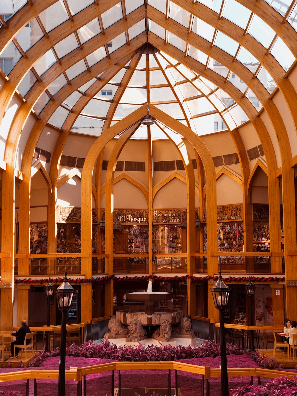 brown wooden chairs and tables inside building