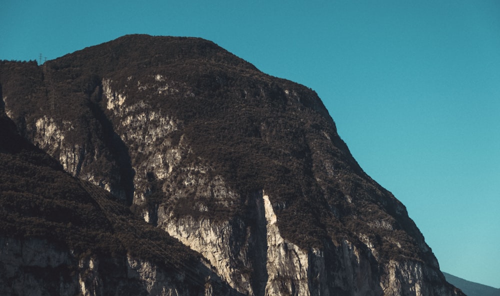 brown rocky mountain under blue sky during daytime