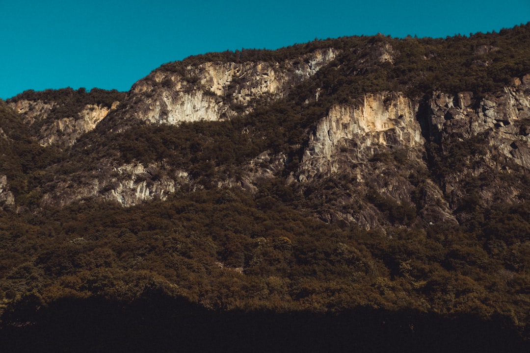 gray rocky mountain under blue sky during daytime