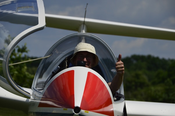 man in white and red plane