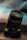 black camera lens on brown wooden table