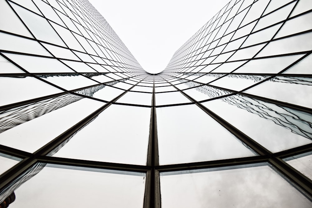 low angle photography of gray metal building