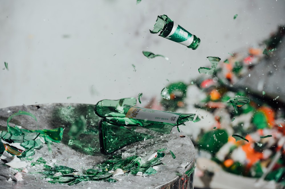 green glass bottle on ice