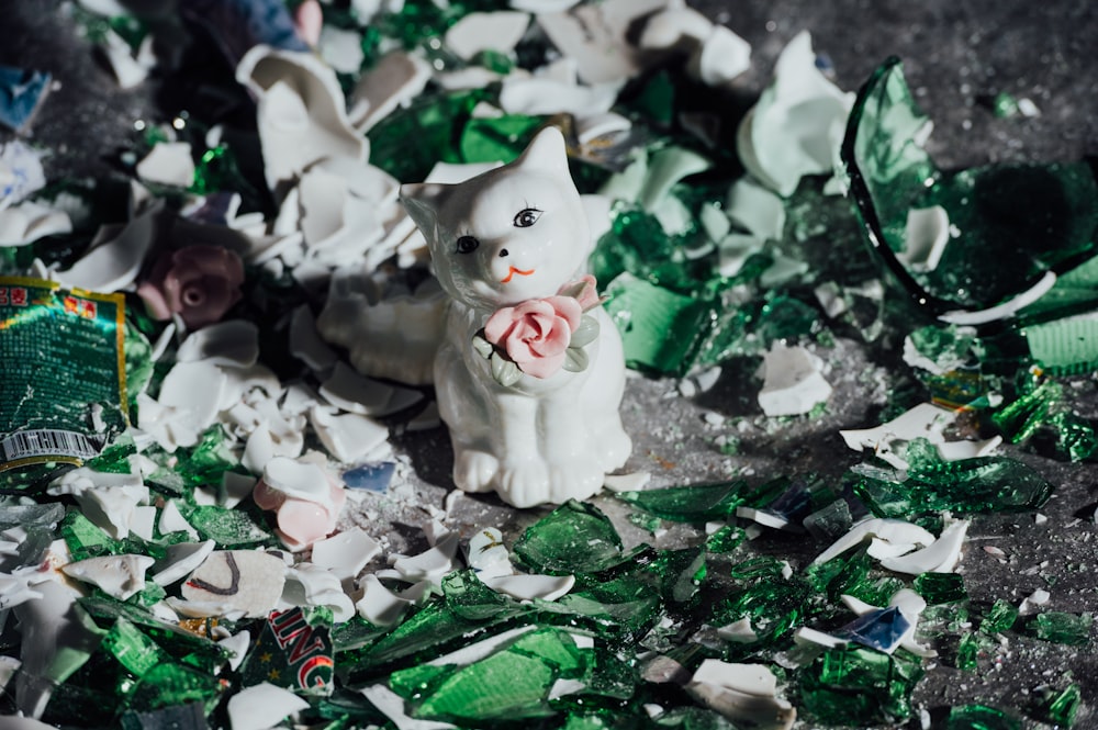 white cat figurine on green and white christmas tree