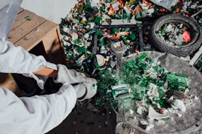 Workers sorting aluminum pieces in the recycling facility.