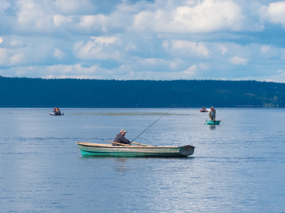 man and woman riding on boat during daytime