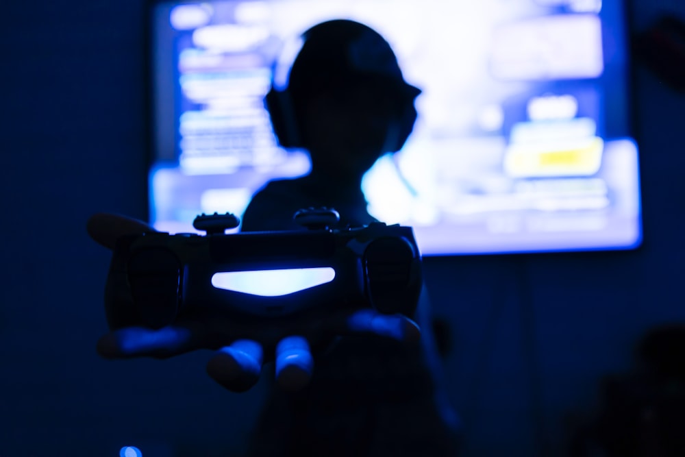 silhouette of man holding camera