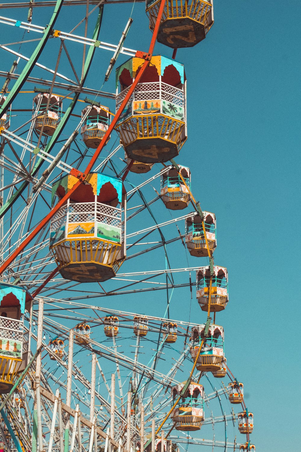 people riding on roller coaster during daytime