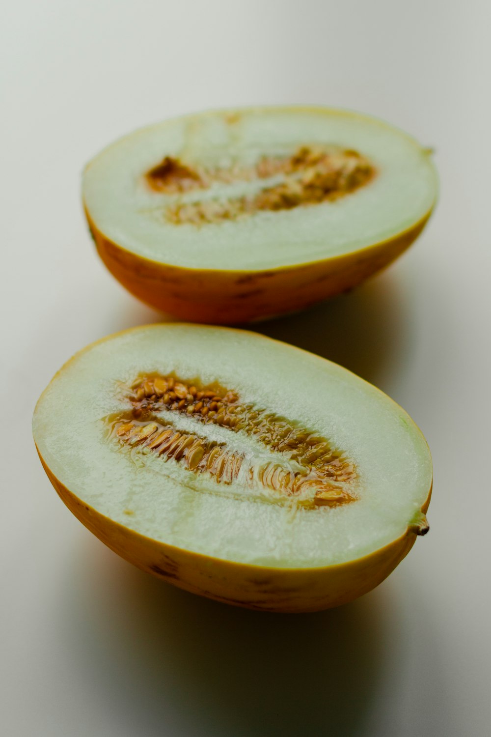 sliced yellow fruit on white surface