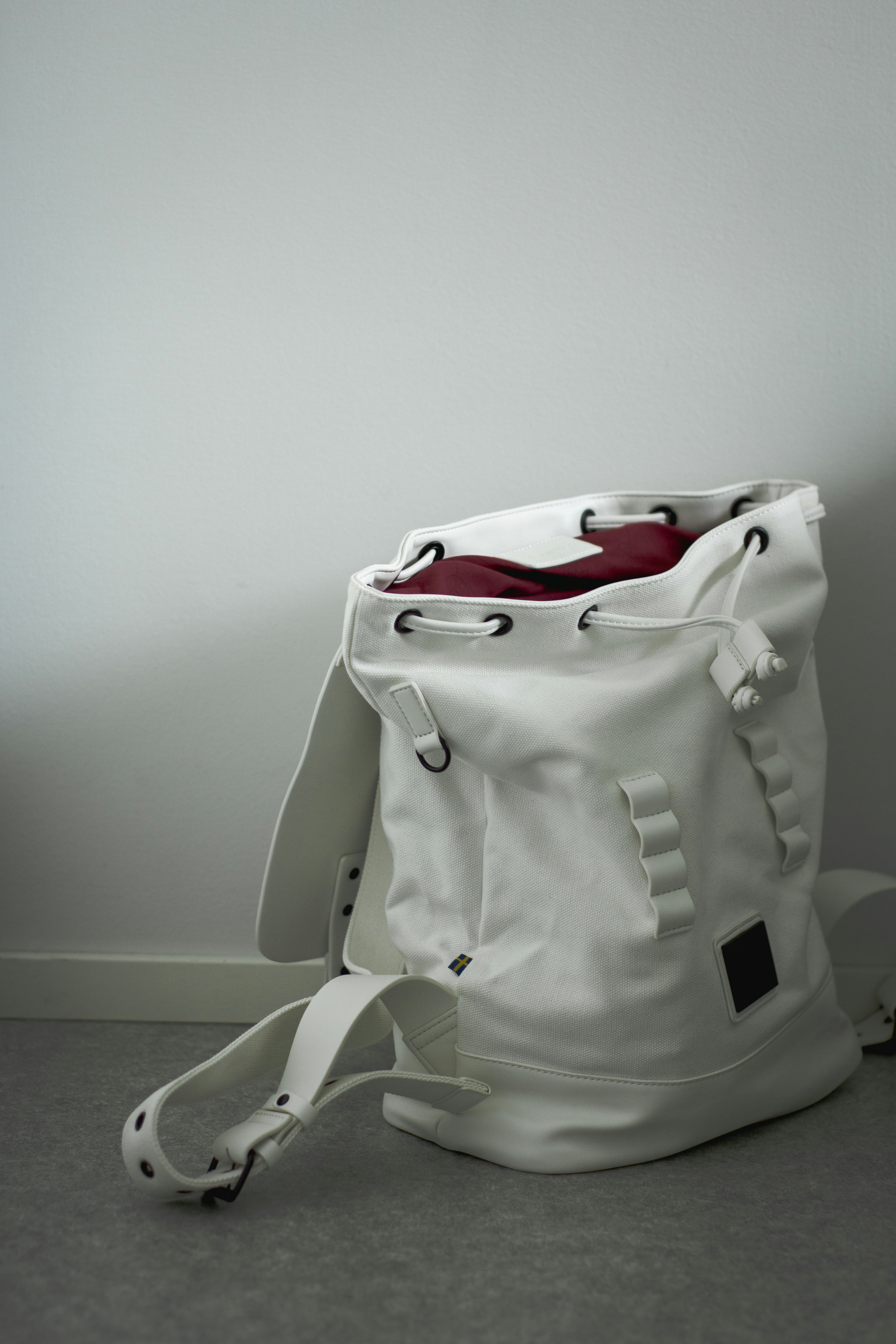 white and black nike backpack