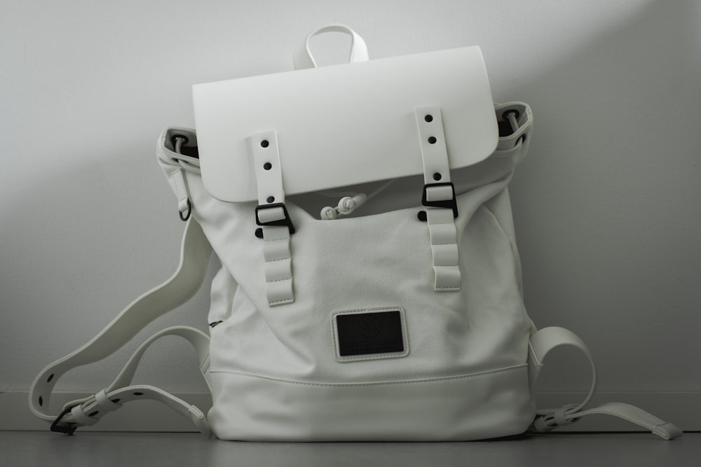 white and black leather handbag