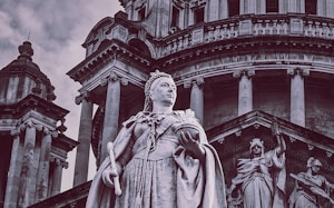 low angle photography of statue of man and woman