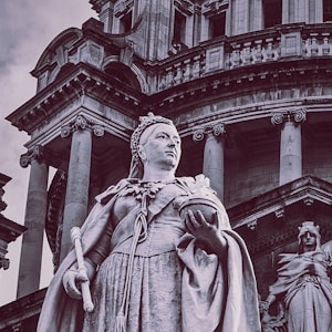 low angle photography of statue of man and woman