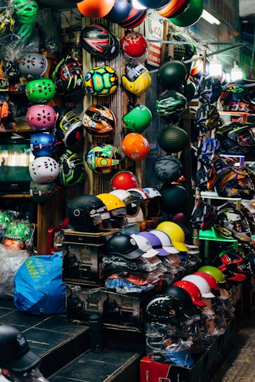 A vibrant display of cycling accessories including helmets and lights.