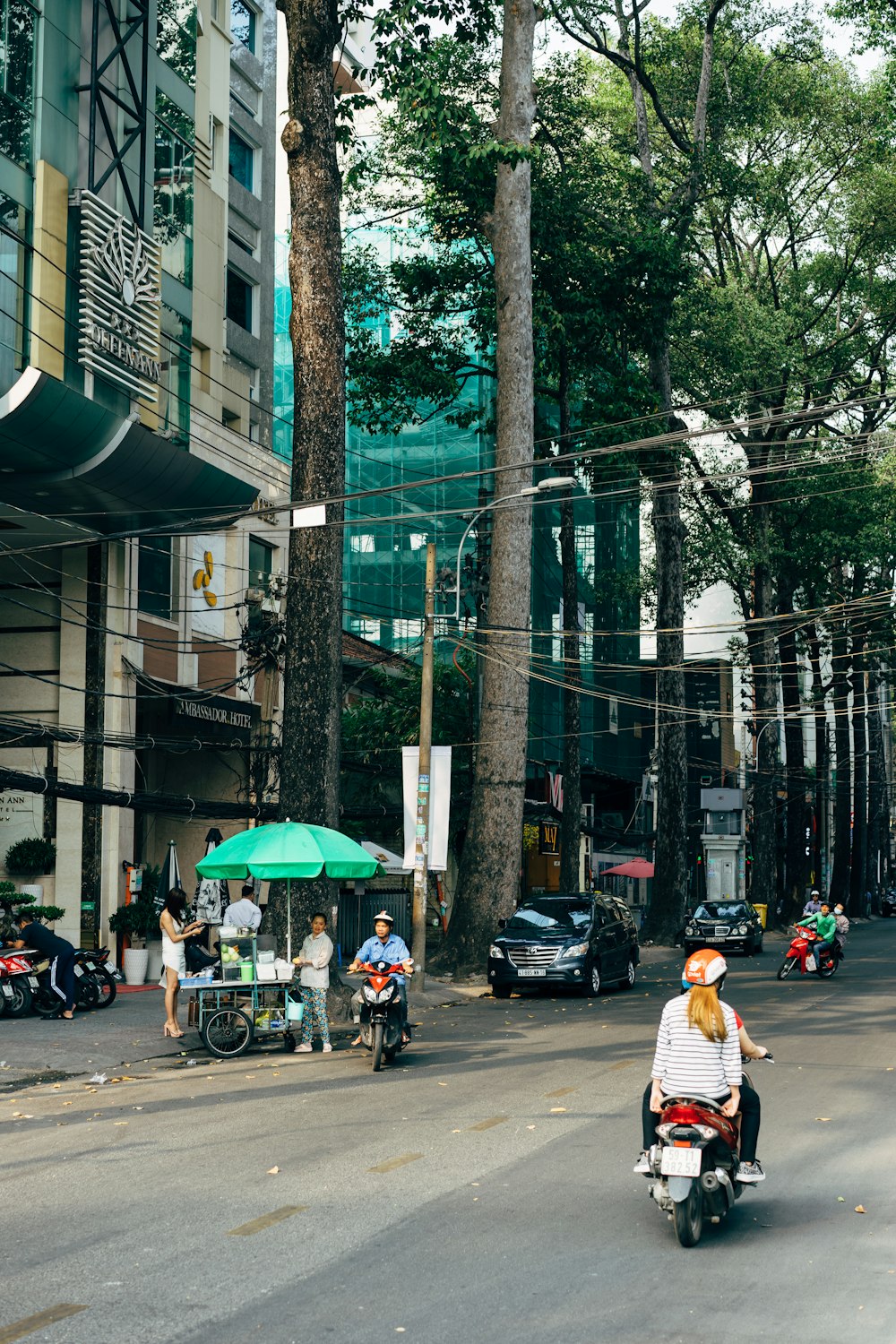 people walking on sidewalk during daytime